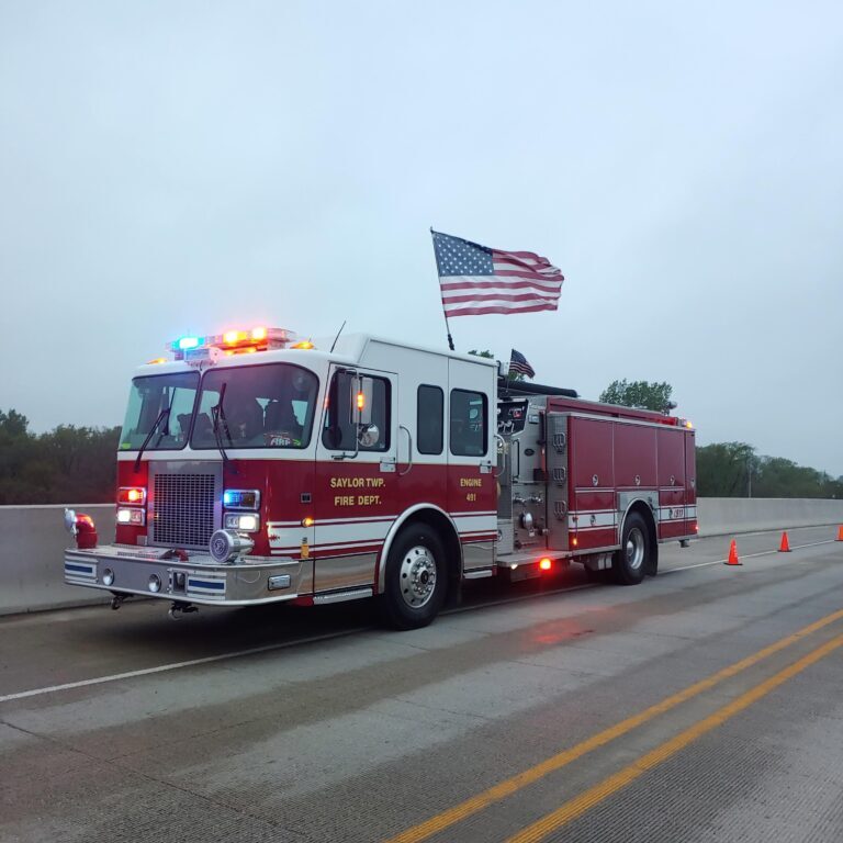 A fire truck with an american flag on it.